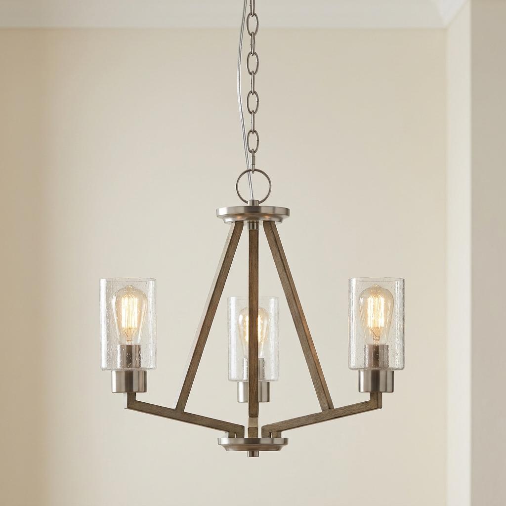 Deryn 3-light grey wood chandelier featuring seeded glass cylindrical shades and warm Edison-style bulbs.