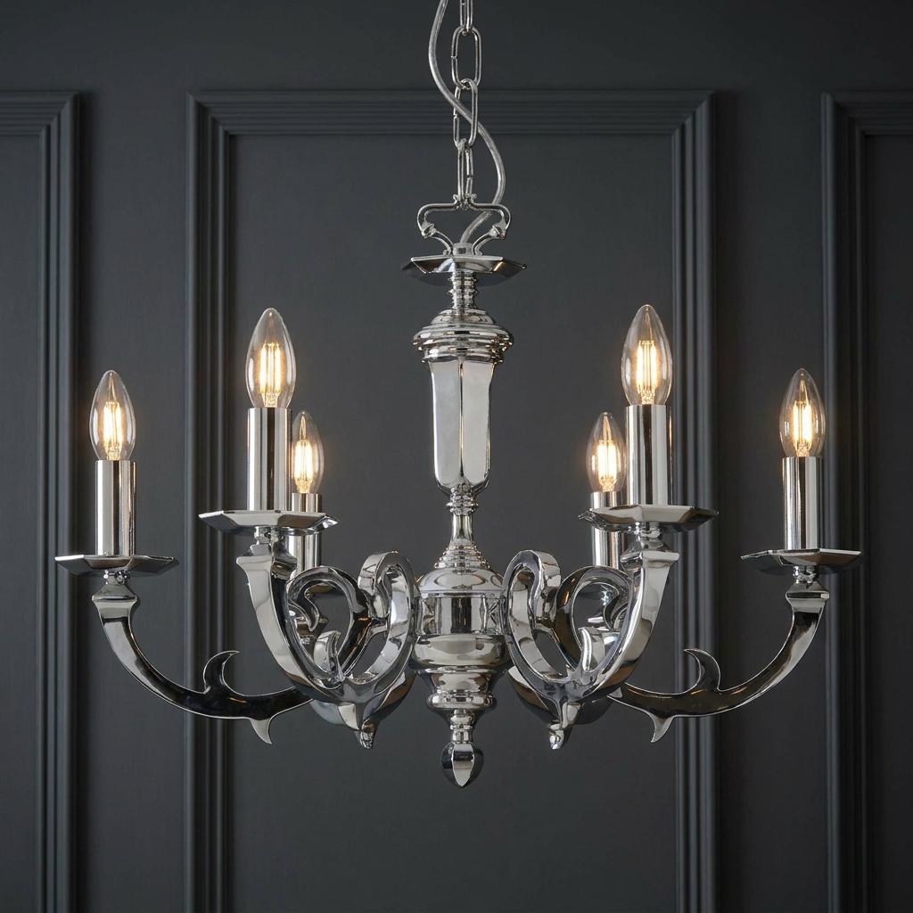Polished chrome 6-light chandelier with glowing candle bulbs set against a dark grey paneled wall.