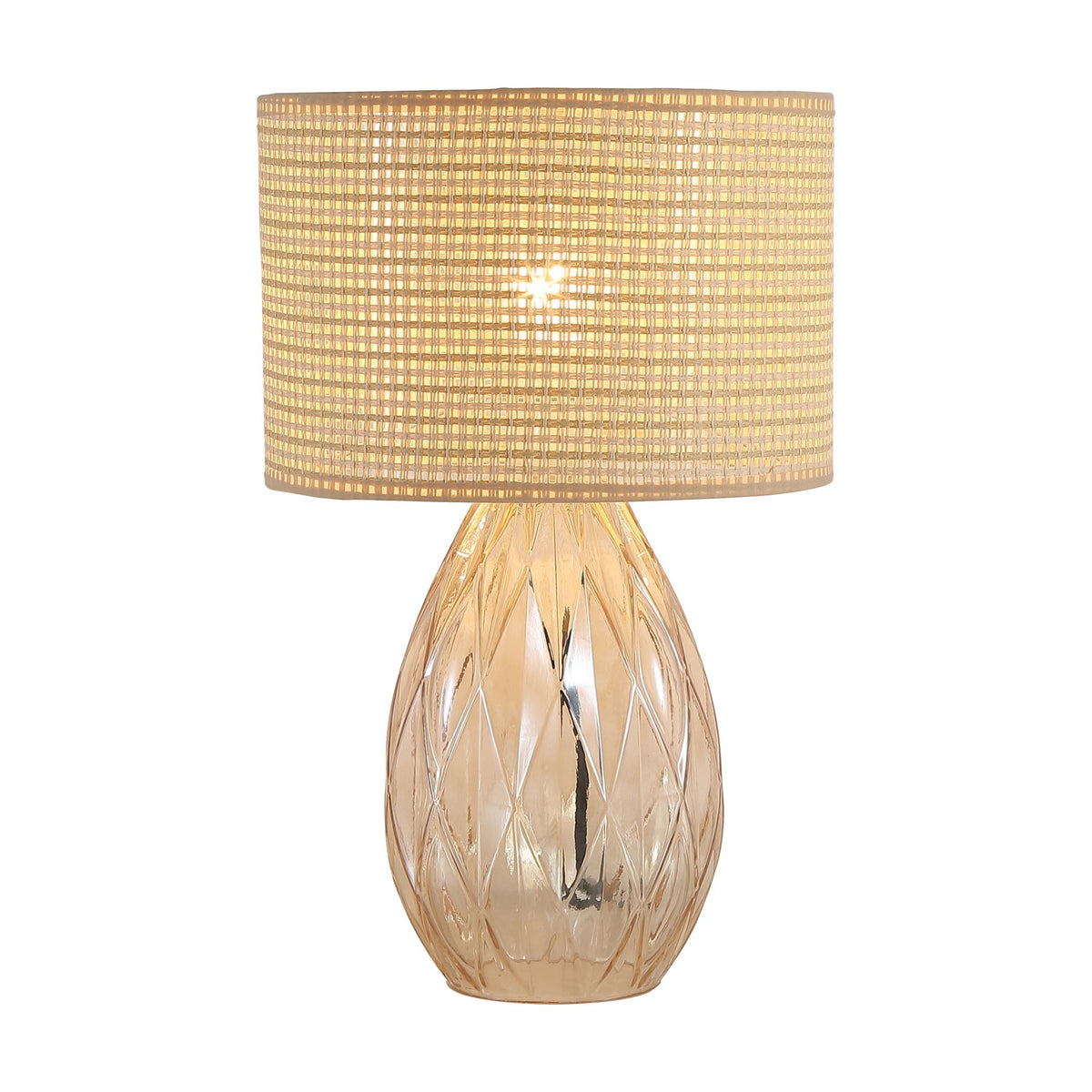 Diane champagne glass table lamp lit with a woven rattan drum shade and faceted base