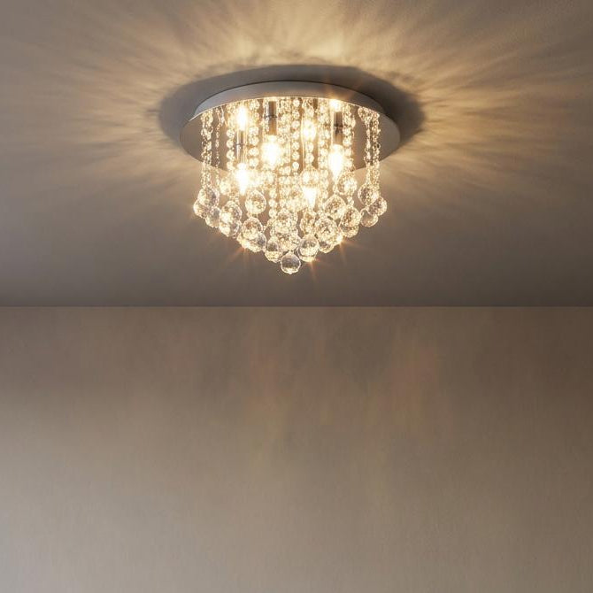 Eglo Almonte crystal flush ceiling light illuminating a minimalist living room with patterned ceiling light.