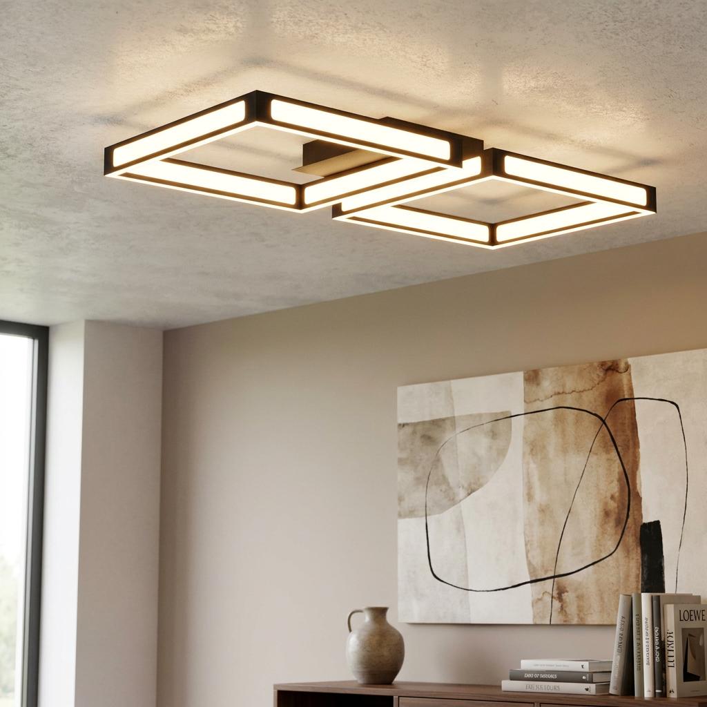 Two interlocking square-shaped black framed LED flush ceiling lights in a modern living room.