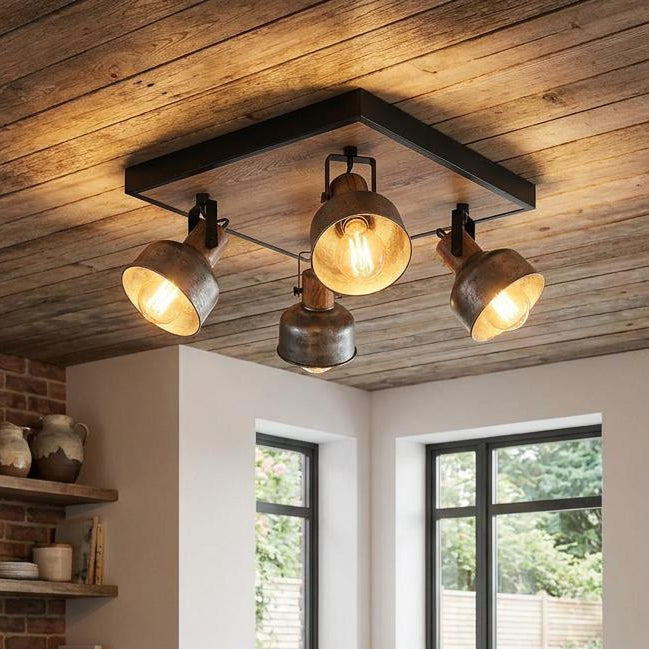 Eglo Barnstaple 4-light plate spotlight in distressed steel and wood on a rustic kitchen ceiling.