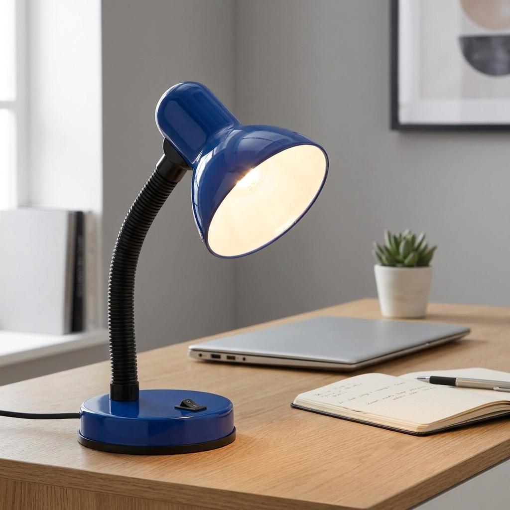 Blue adjustable desk lamp with a flexible neck illuminated on a wooden desk next to a laptop and notebook.