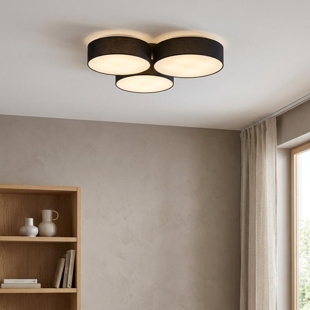 Eglo Barbano-Z smart ceiling flush light with three black drum shades illuminating a neutral living room.