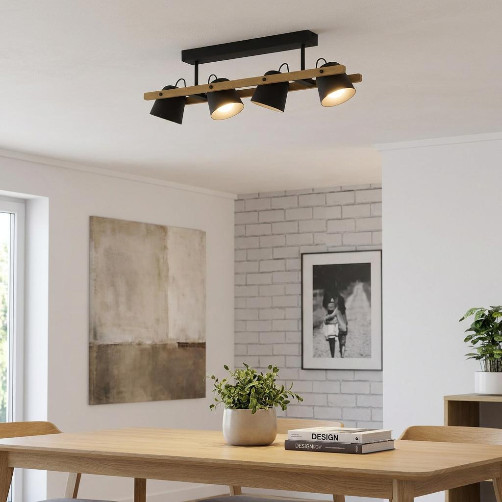 Eglo Hornwood-Z 4-light black and wood flush ceiling fixture illuminated above a modern wooden dining table.