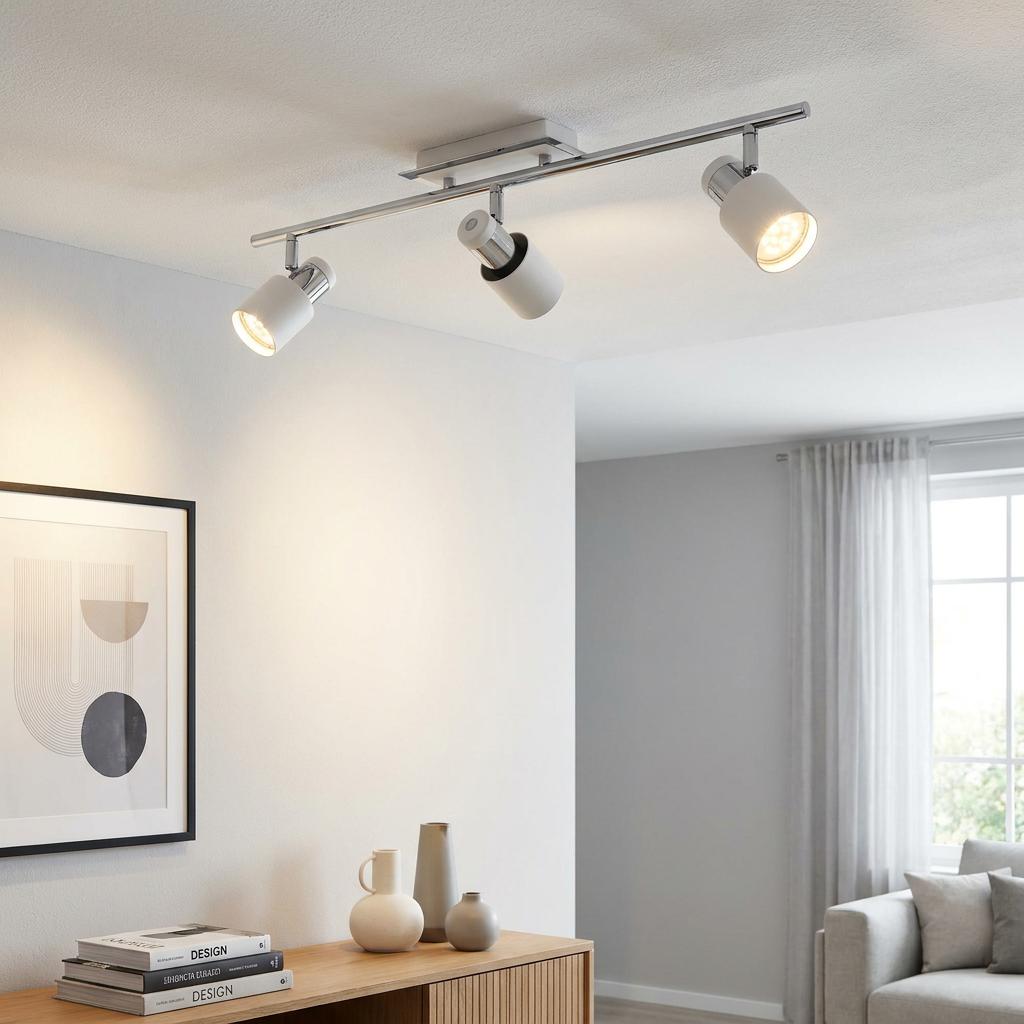 Eglo Davida 3-light chrome and white bar spotlight mounted on a white ceiling in a modern living room setting.