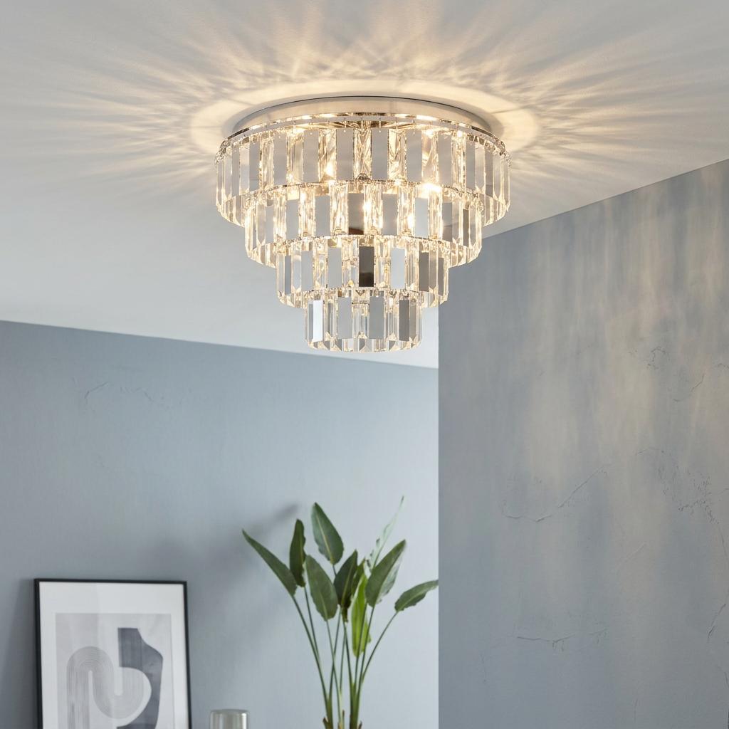 Tiered crystal flush ceiling light with clear rectangular glass panels in a modern living space.