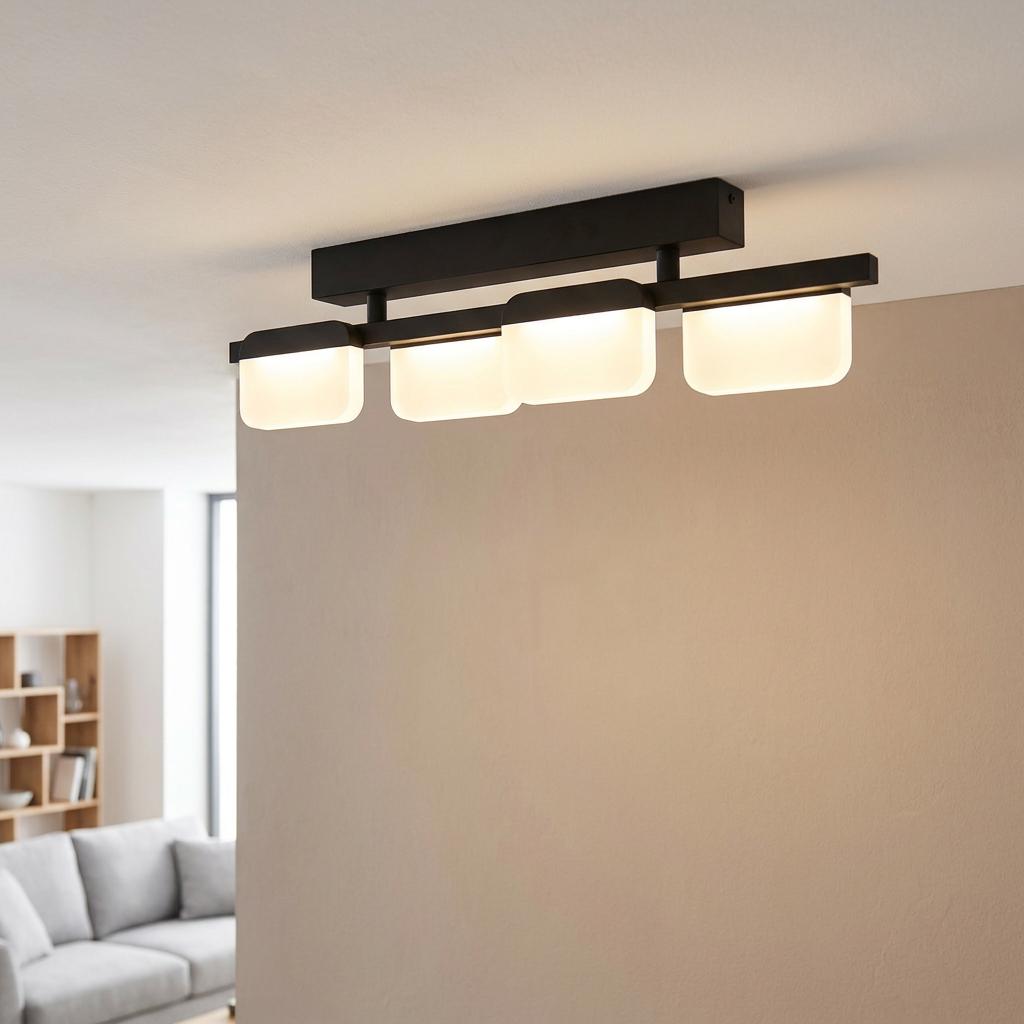 Modern black 4-light LED ceiling flush with glowing white acrylic shades mounted in a contemporary living room.