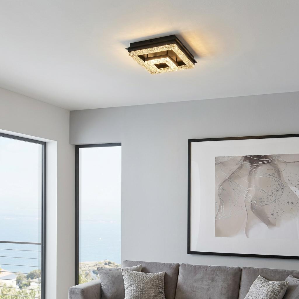 Square black and crystal LED flush ceiling light mounted in a bright, modern living room.