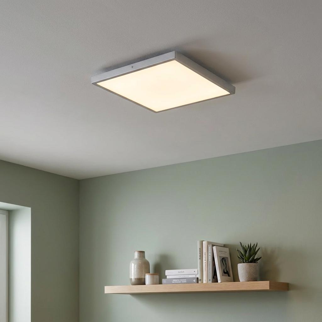 Eglo Fueva 1 square silver LED flush ceiling light mounted on a white ceiling above a wall-mounted wooden shelf.