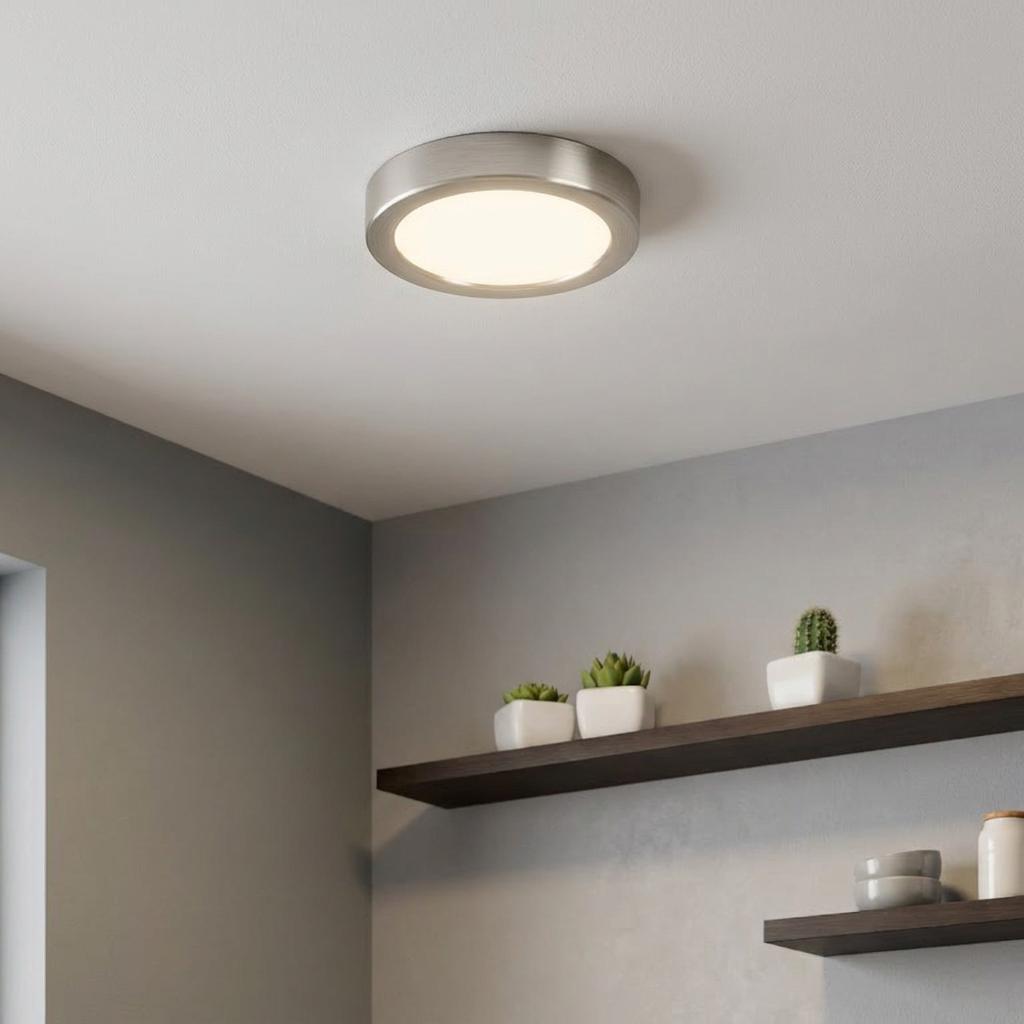 Round Eglo Fueva 5 LED flush ceiling light with a satin nickel finish, illuminated on a white ceiling.