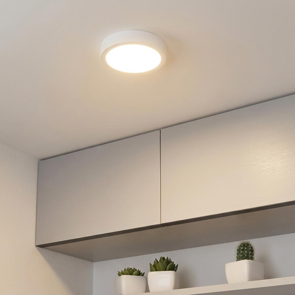 Eglo Fueva 5 white circular LED flush ceiling light mounted above minimalist cabinets in a bright room.