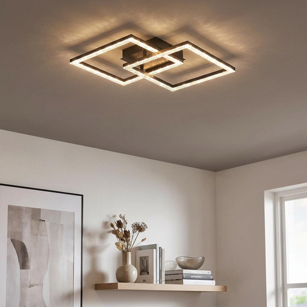 Interlocking black square LED ceiling flush light with crystal-effect diffusers illuminating a modern room.