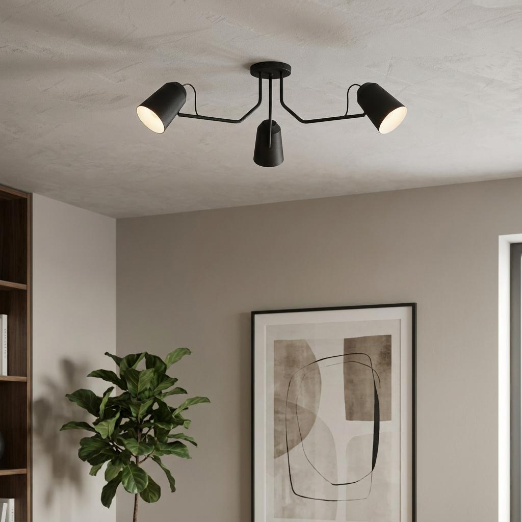 Eglo Loreto black metal 3-arm adjustable ceiling flush light in a modern interior with a plant and framed art.