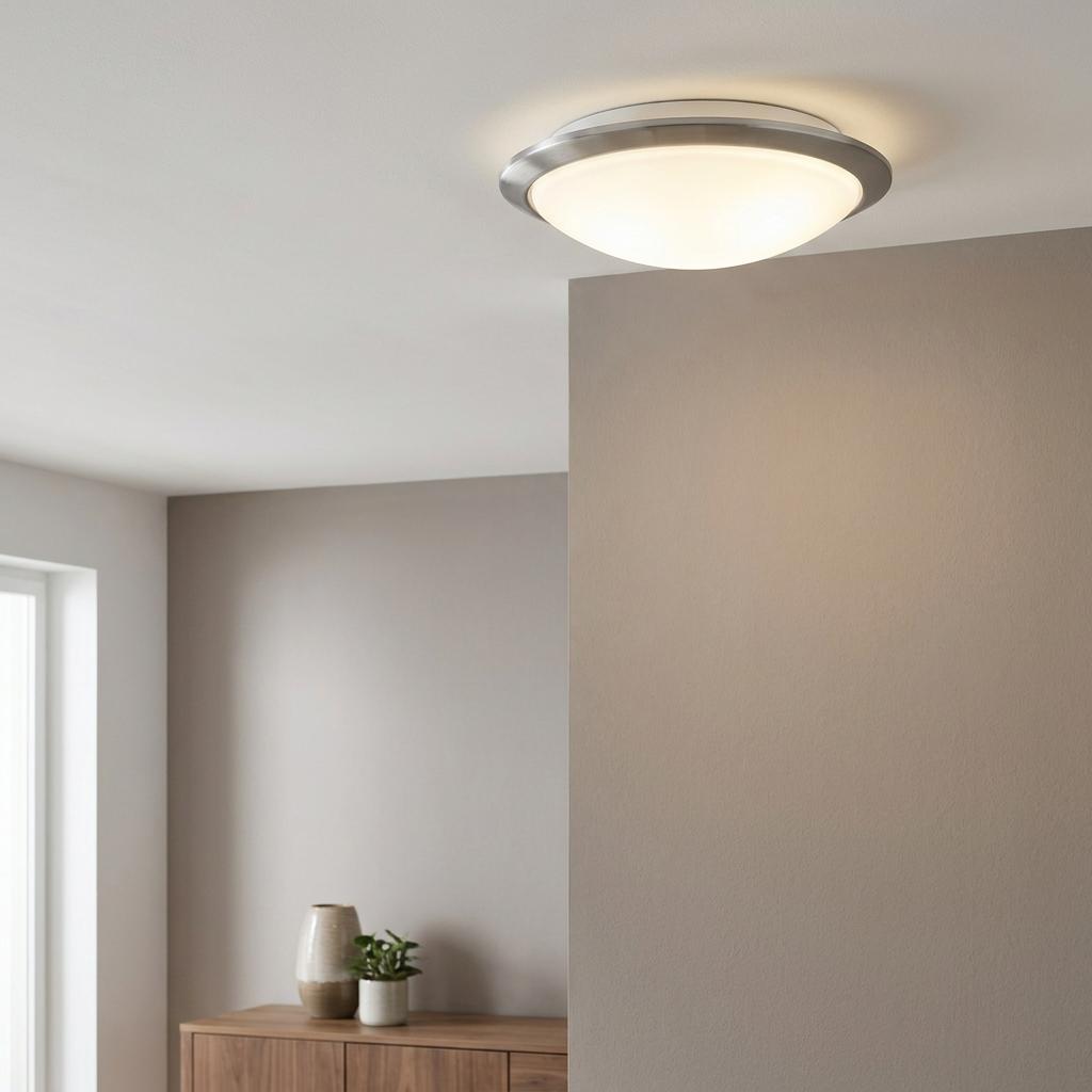 Illuminated Eglo Mars 1 flush ceiling light with silver rim and satin glass diffuser in a neutral room.