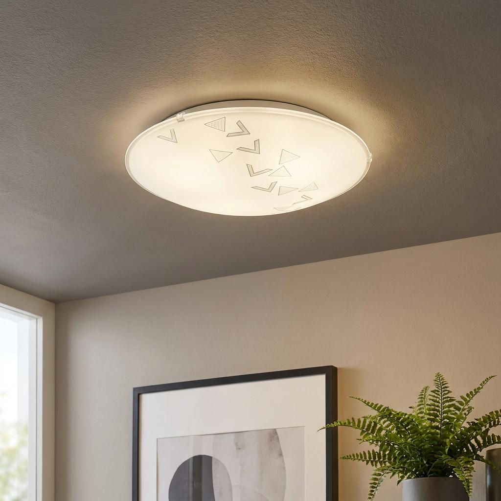 Eglo Mars white satin glass flush ceiling light with a geometric pattern, illuminated on a neutral ceiling.
