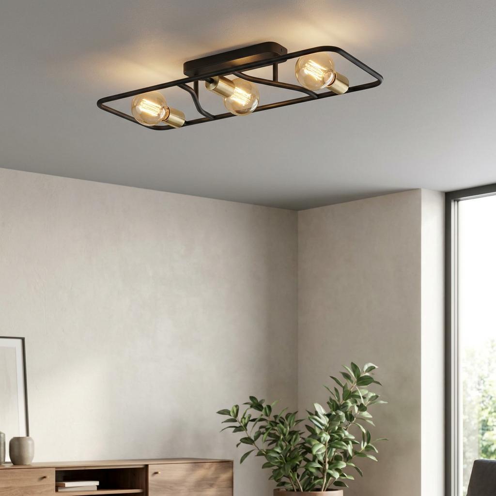 Industrial black and brass three-light flush ceiling fixture with exposed vintage bulbs in a minimalist room.