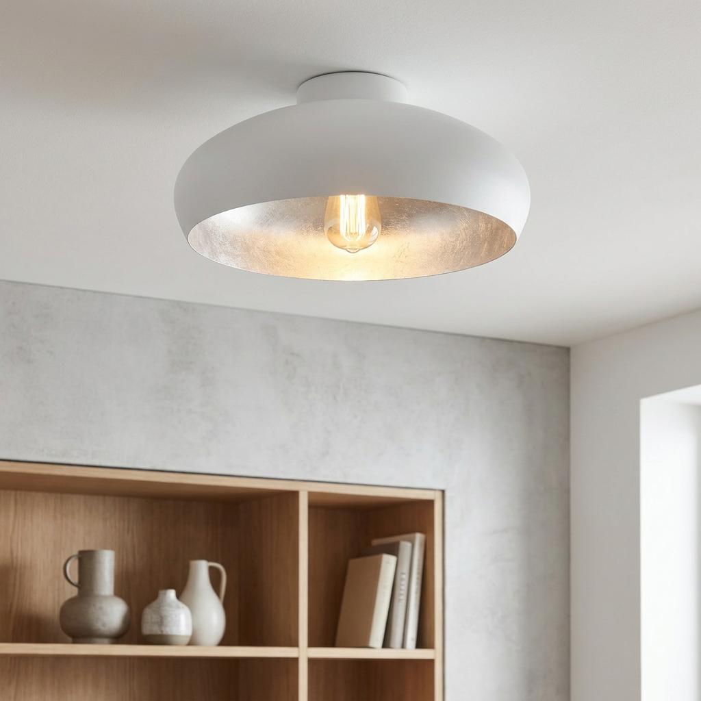 Eglo Mogano flush white ceiling light with a silver interior and warm bulb, mounted in a minimalist room.