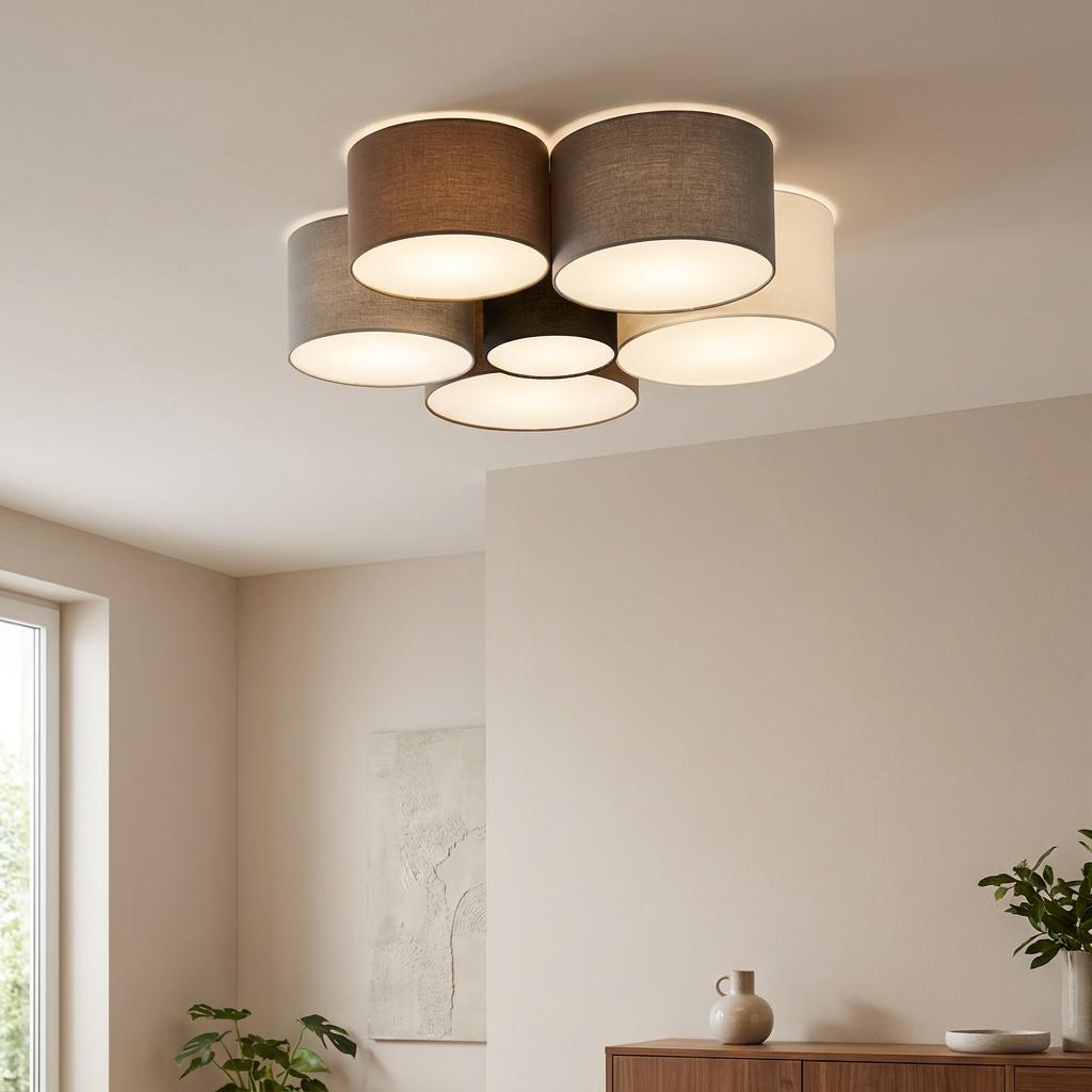 Cluster of six neutral-toned fabric drum shades mounted as a flush ceiling light in a modern room.