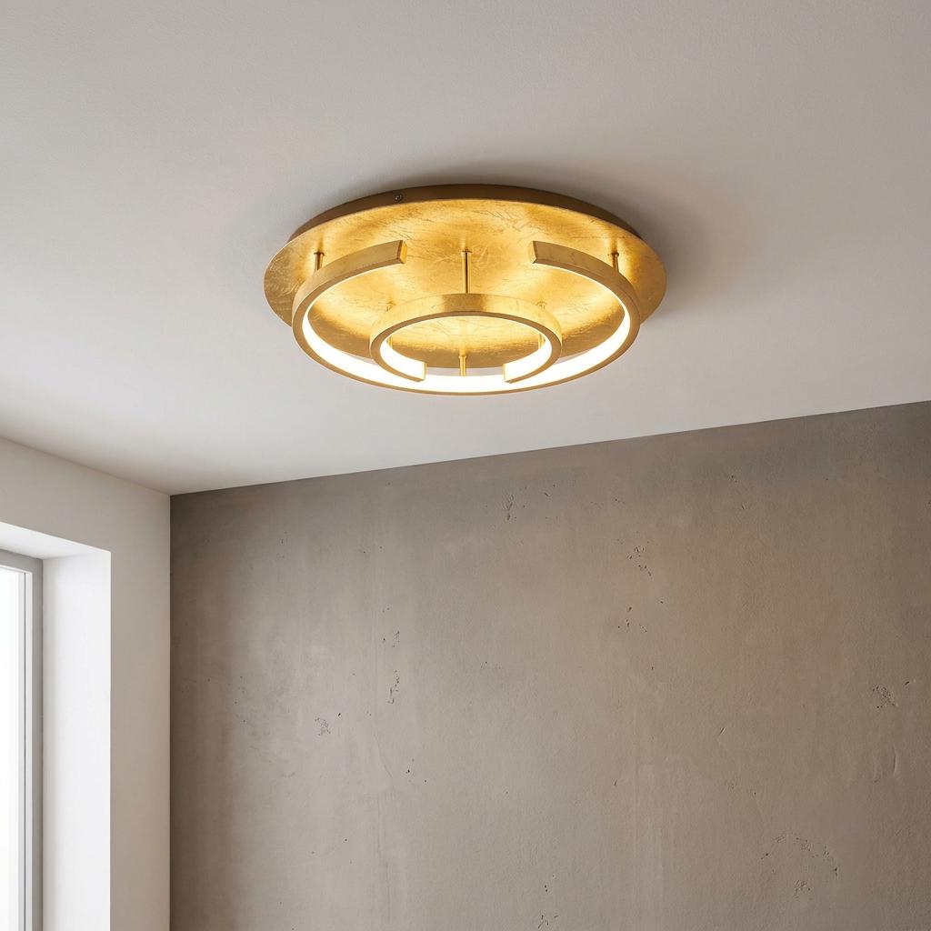 Eglo Pozondon gold leaf flush ceiling light with two illuminated concentric rings on a white ceiling.