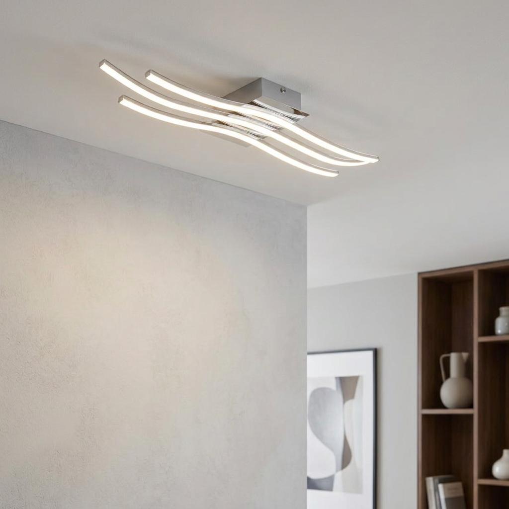Modern Eglo Roncade chrome flush ceiling light with three curved LED arms in a minimalist interior setting.