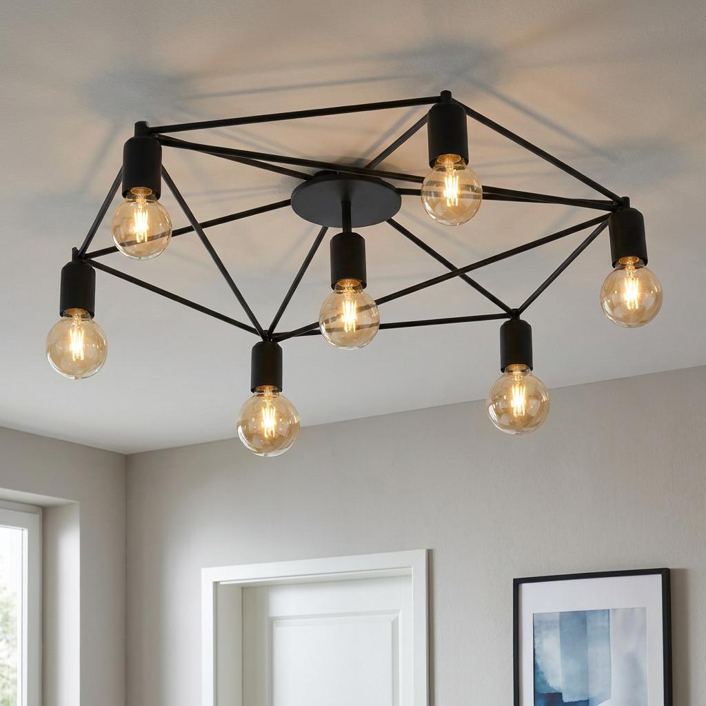Eglo Staiti black geometric wire 7-light flush ceiling fixture with exposed filament bulbs on a white ceiling.