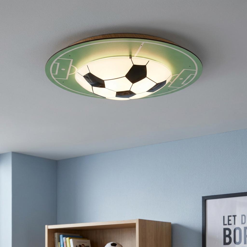 Football-themed ceiling flush light with a green pitch design and a central soccer ball diffuser in a child's bedroom.