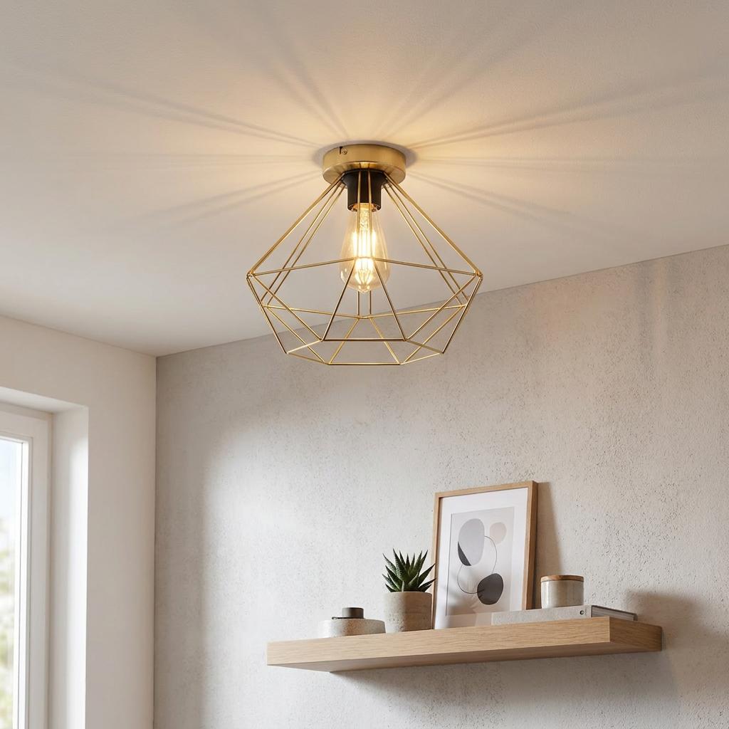 Gold geometric wire flush ceiling light with a filament bulb casting shadows in a modern interior room.