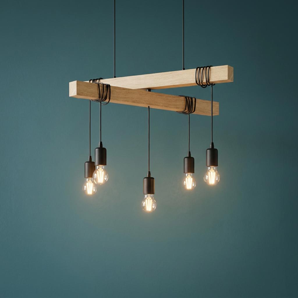 Industrial five-light ceiling pendant with crossed wooden beams and exposed bulbs against a teal wall.