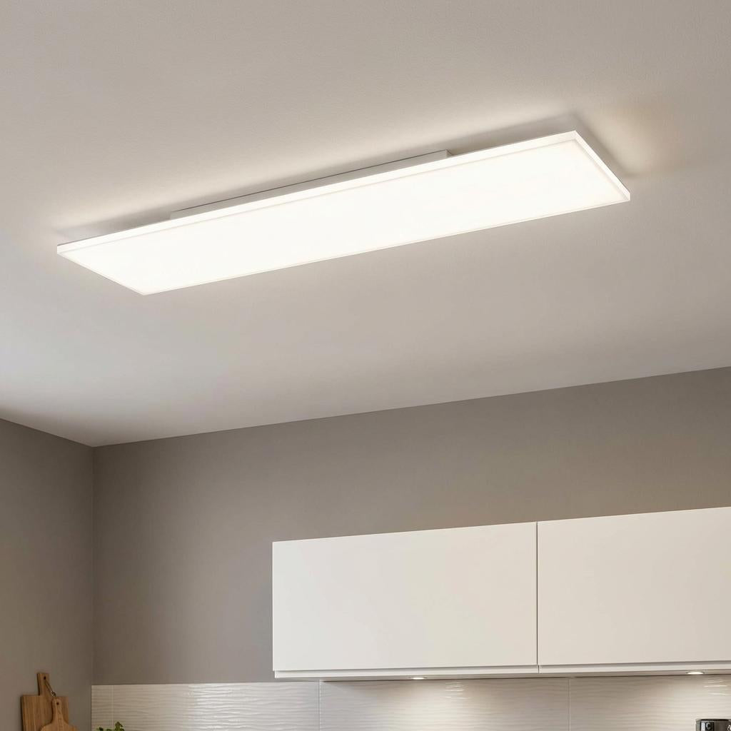 Rectangular white LED panel light flush-mounted on a kitchen ceiling providing bright, even illumination.