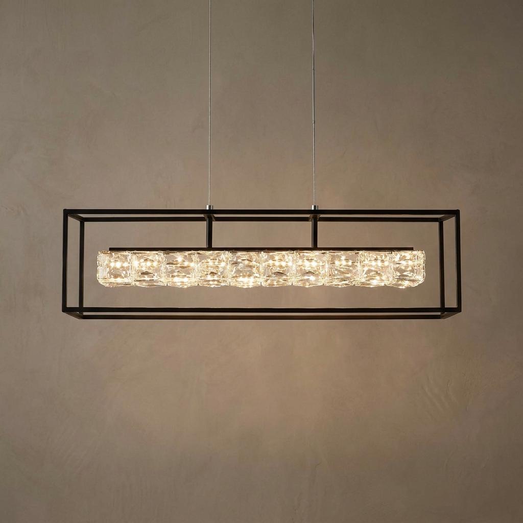 Modern black rectangular frame pendant light featuring glowing crystal drops against a beige textured wall.