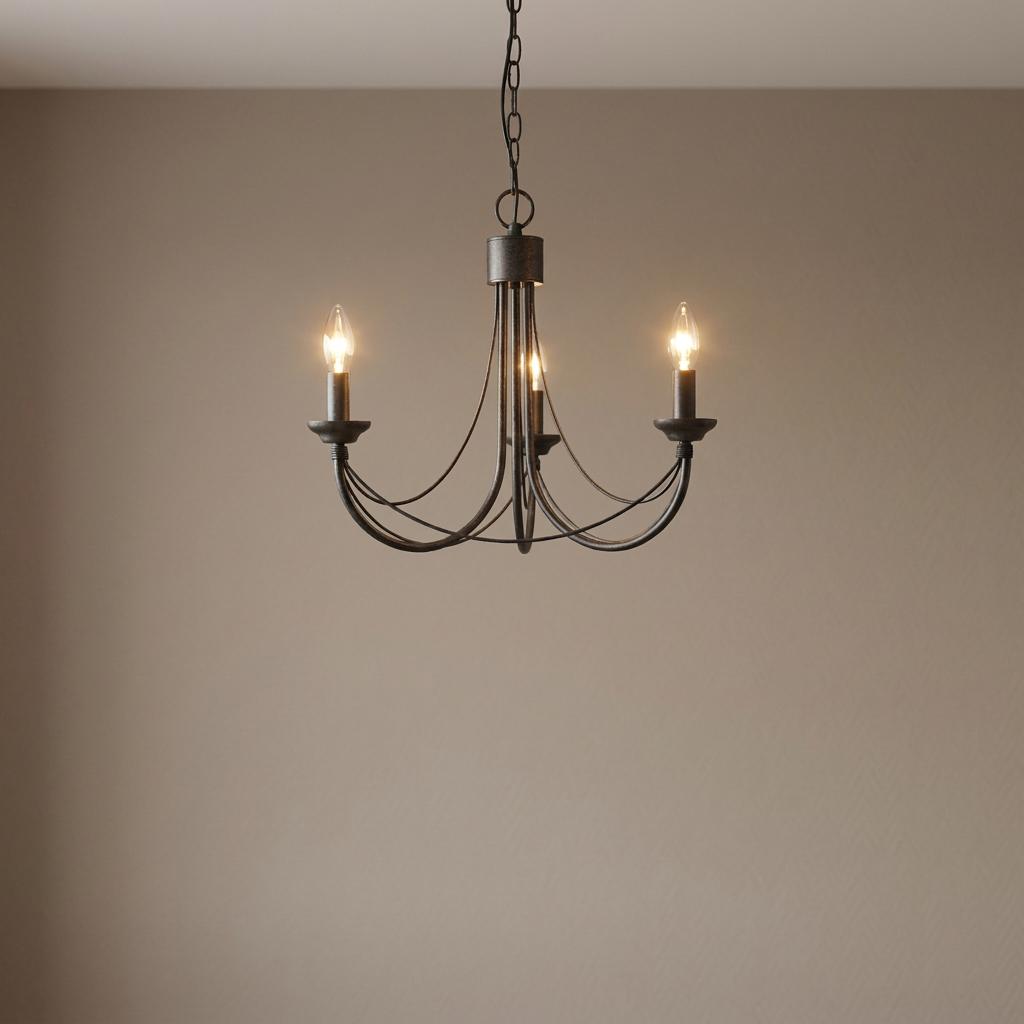 Elstead Carisbrooke 3-light black chandelier with curved iron arms and candle bulbs against a neutral wall.
