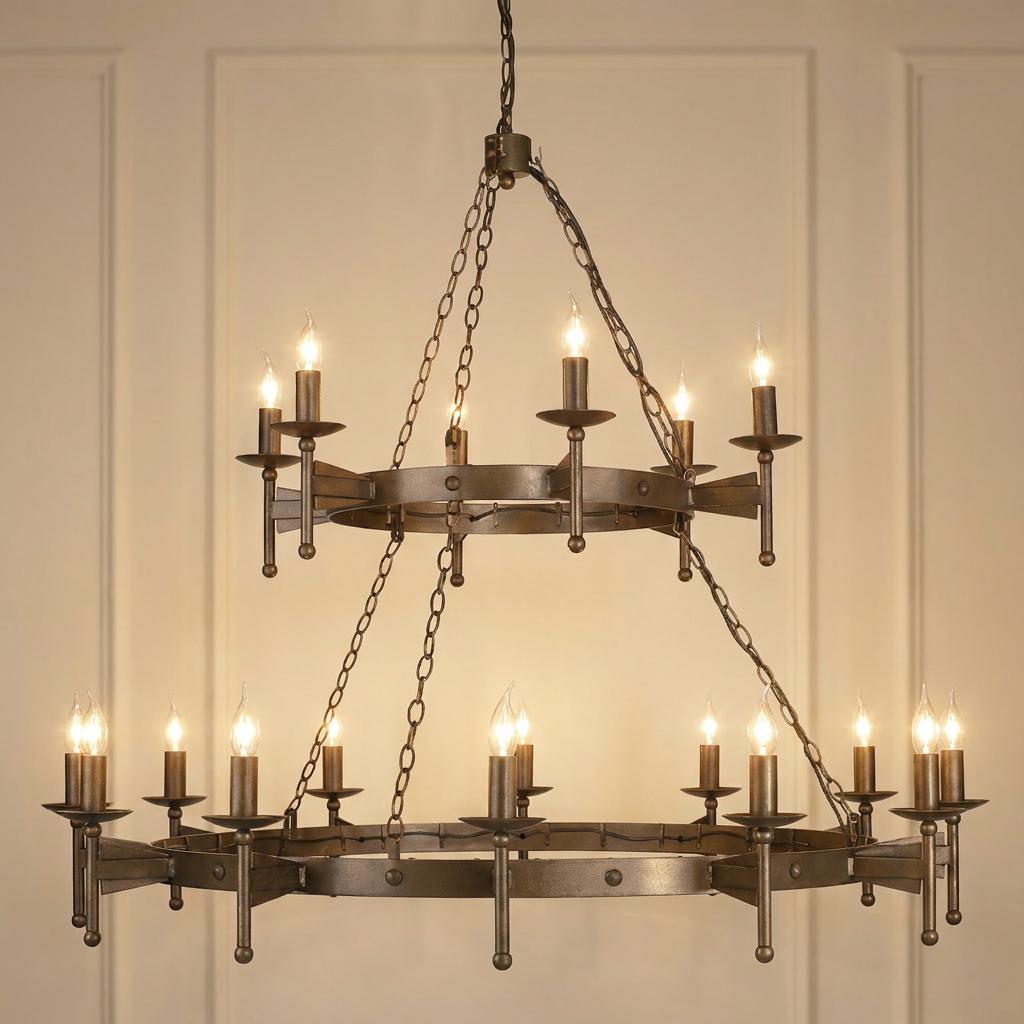 A two-tier medieval style hoop chandelier in old bronze with 18 lit candle bulbs against a paneled wall.