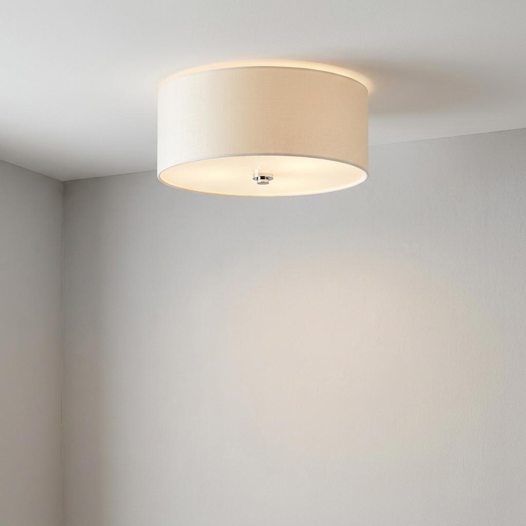An illuminated Elstead Fletcher 14-inch flush drum shade light with a polished chrome finial on a white ceiling.