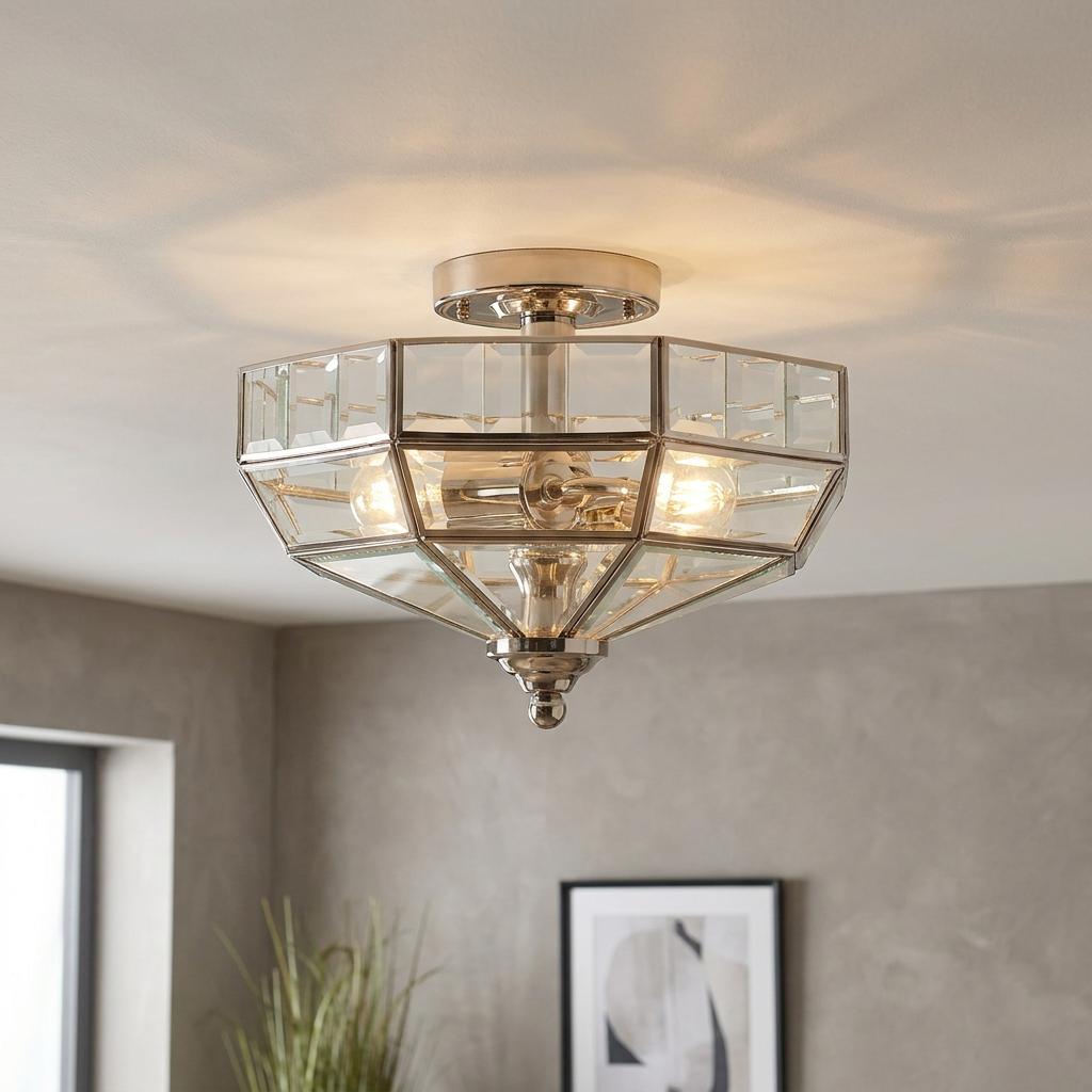 A polished nickel semi-flush ceiling light featuring a geometric glass lantern design.