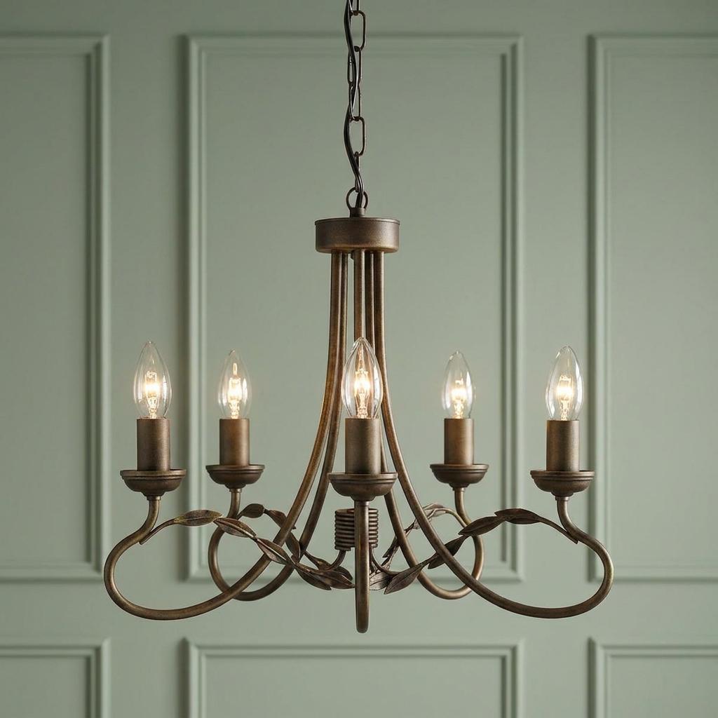 Elstead Olivia 5-light chandelier with bronze-finished scrollwork and leaf details against a green paneled wall.