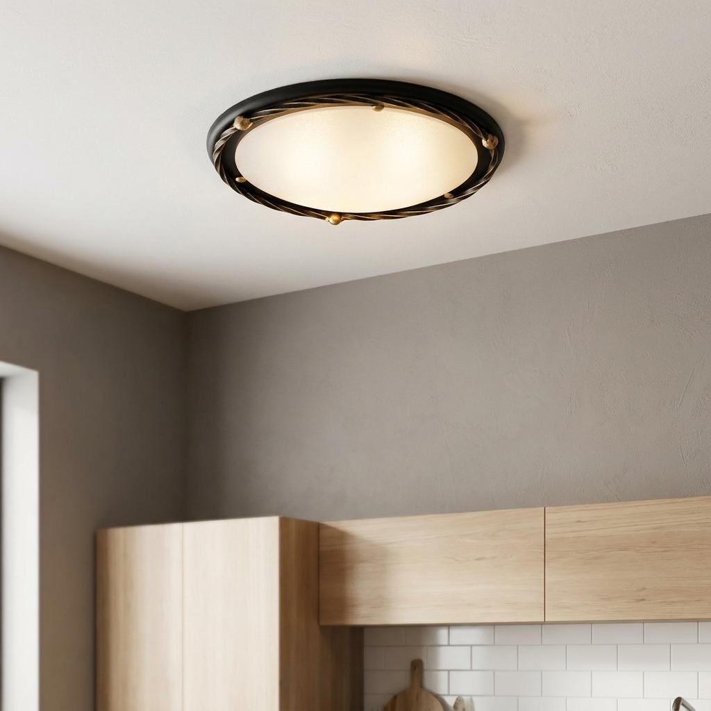 Elstead Pembroke flush ceiling light with black and gold twisted frame and frosted glass in a modern kitchen.