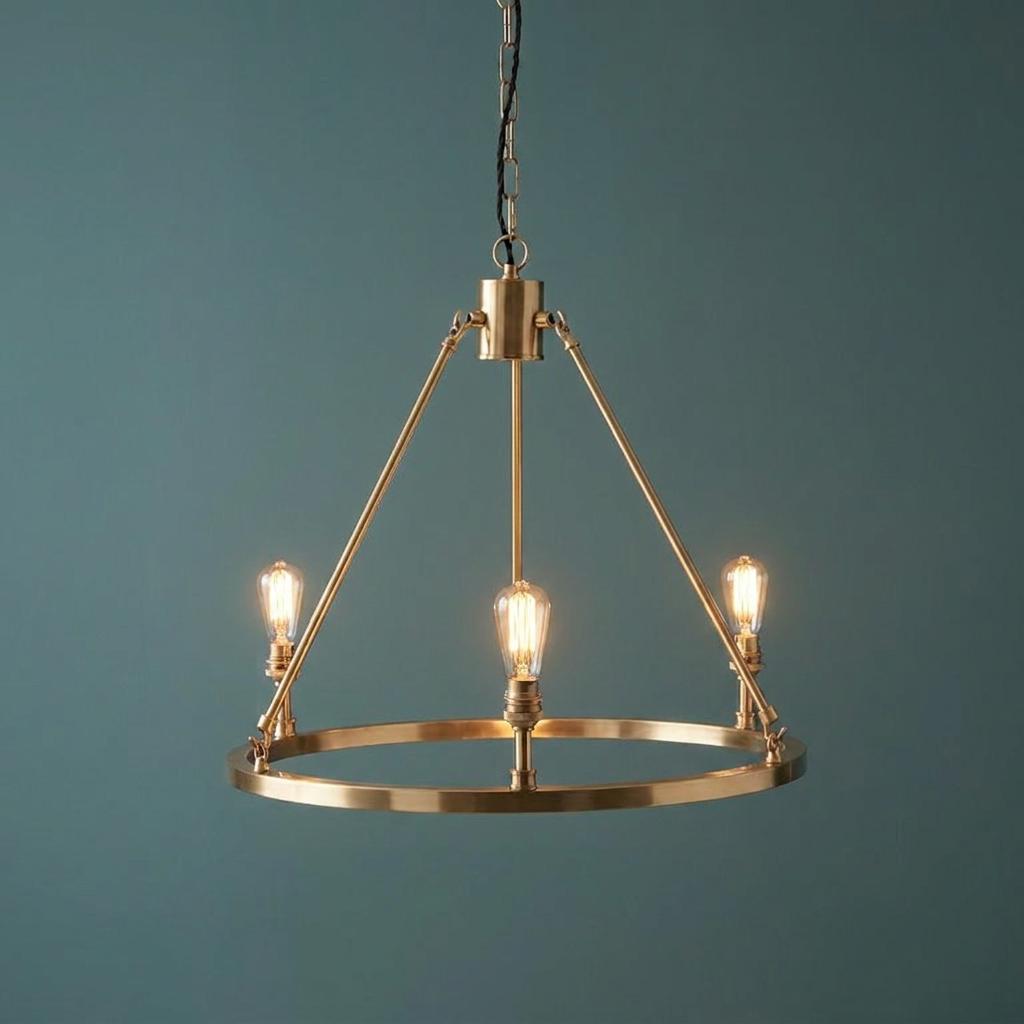 Endon Chester three-light brass pendant chandelier with vintage-style bulbs against a teal background.