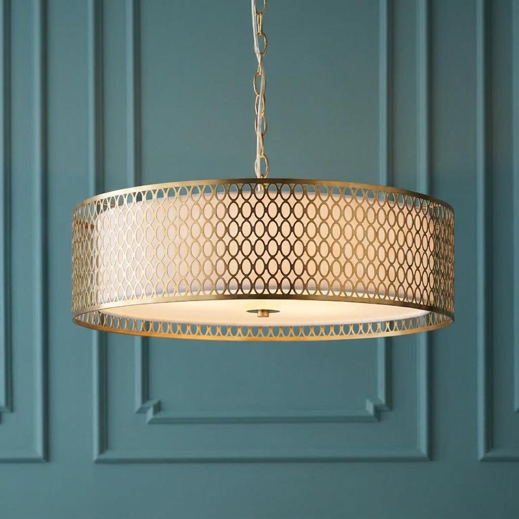 Endon Cordero 3-light gold ceiling pendant with a lattice drum shade against a teal paneled wall.