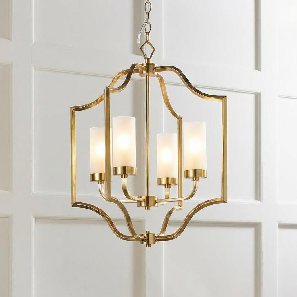 Endon Edrea 4-light brass pendant with frosted glass cylinders against a white wood paneled wall.