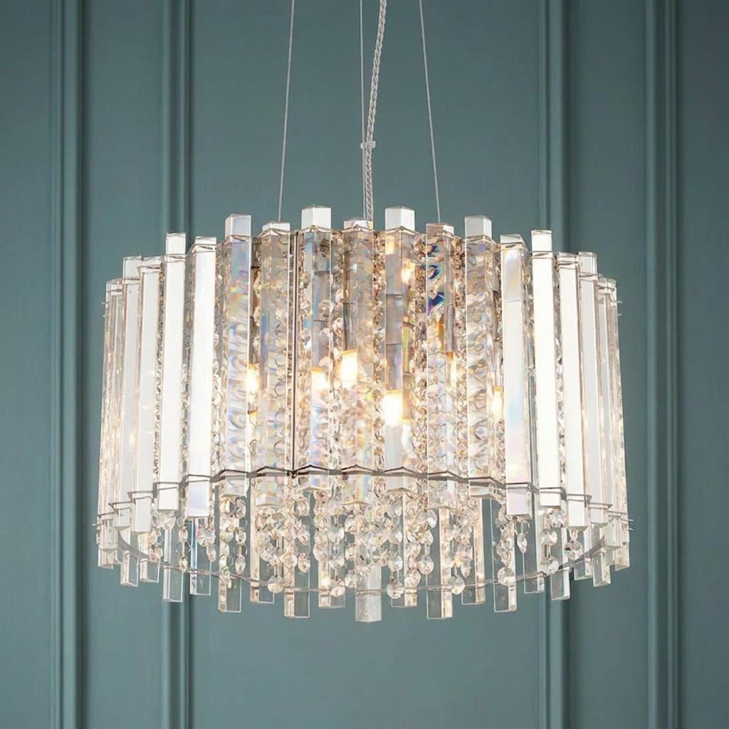 Endon Hanna 5 light polished chrome pendant ceiling light featuring tiered glass prisms against a teal paneled wall.