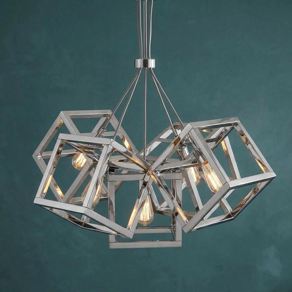 Ensemble 5 light polished nickel pendant with interlocking geometric frames and filament bulbs against a teal wall.
