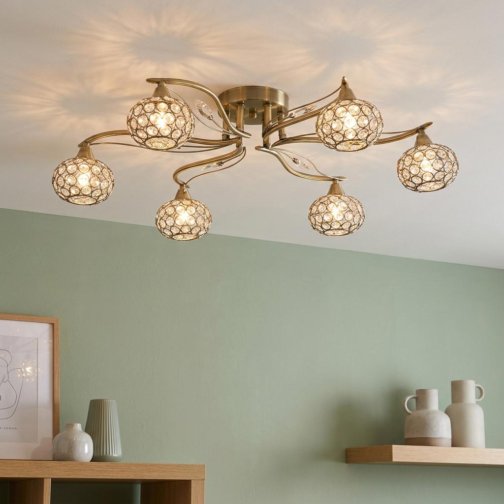 Esmee six-light antique brass flush ceiling fixture with jewelled crystal shades mounted in a modern living room.