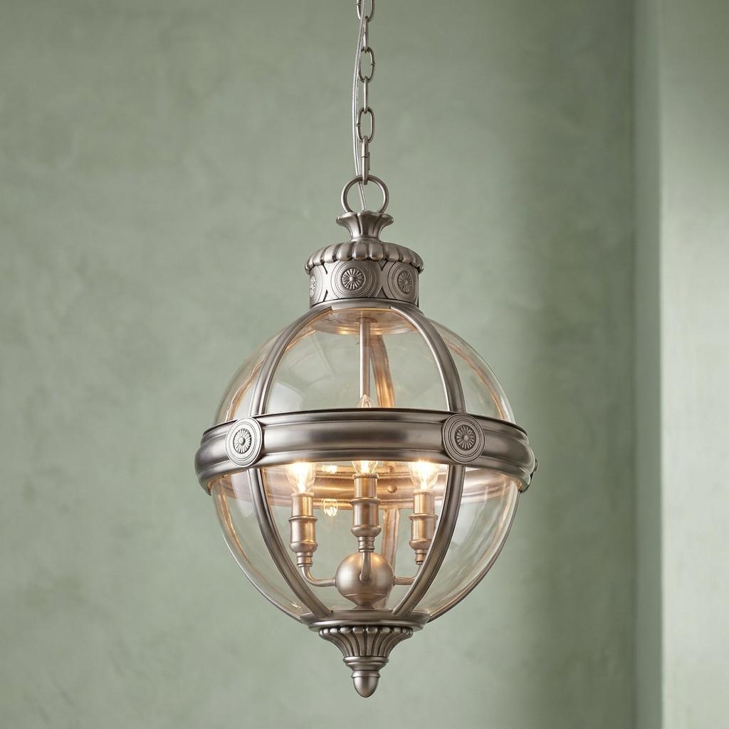 A Feiss Adams 3-light pendant ceiling light with a clear glass globe and antique nickel finish.