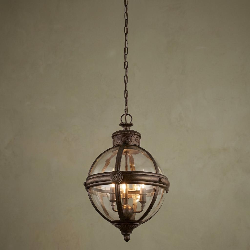 Bronze spherical 3-light lantern with clear glass, decorative band, and orbital frame hanging from a chain.