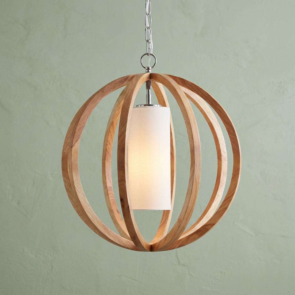 Feiss Allier wooden orb pendant light with a white fabric shade hanging against a textured green background.