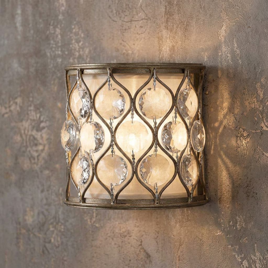 Silver lattice wall sconce featuring hanging crystals and a cream shade mounted on a textured wall.