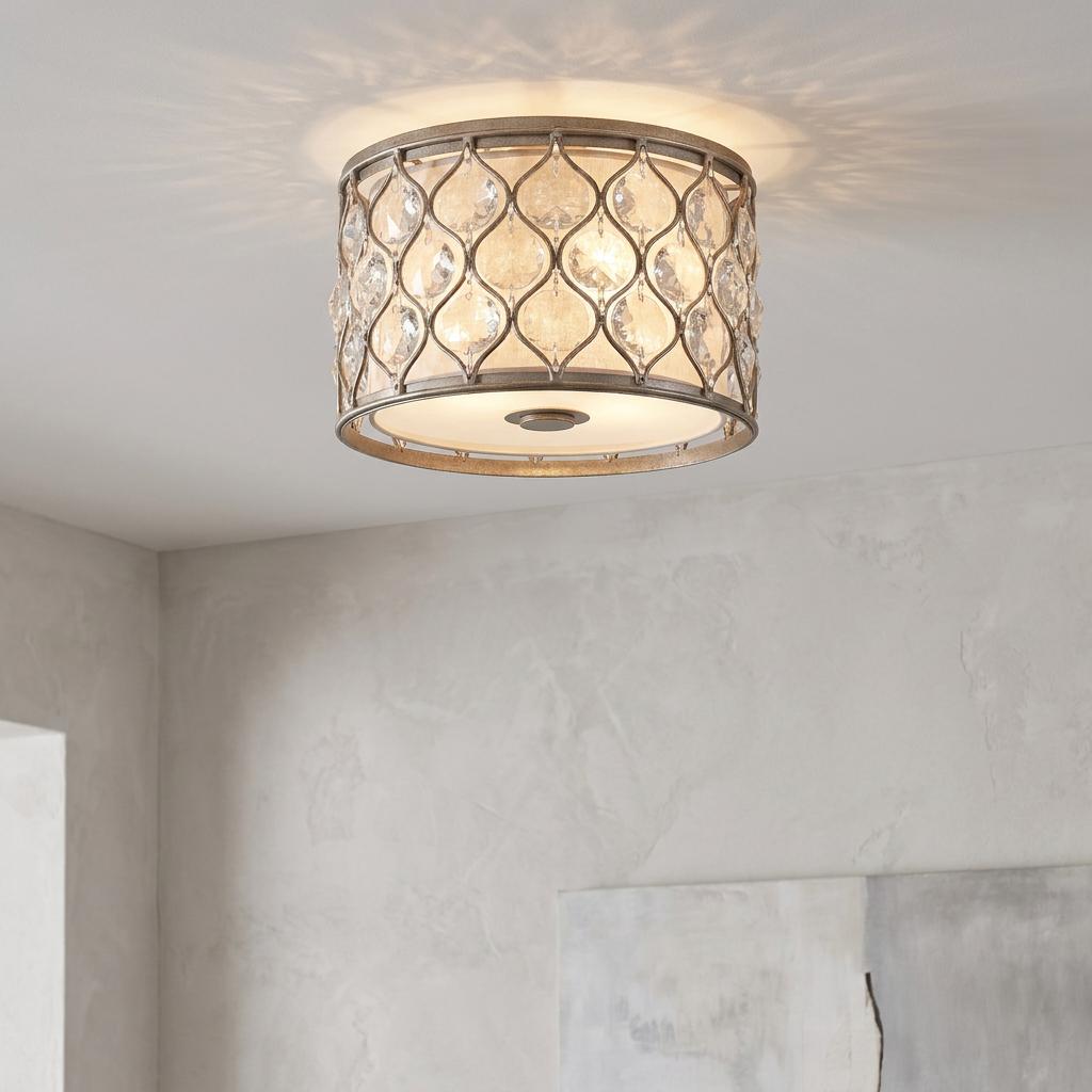 Silver flush ceiling light with crystal droplets in a lattice frame, casting patterned light on a white ceiling.