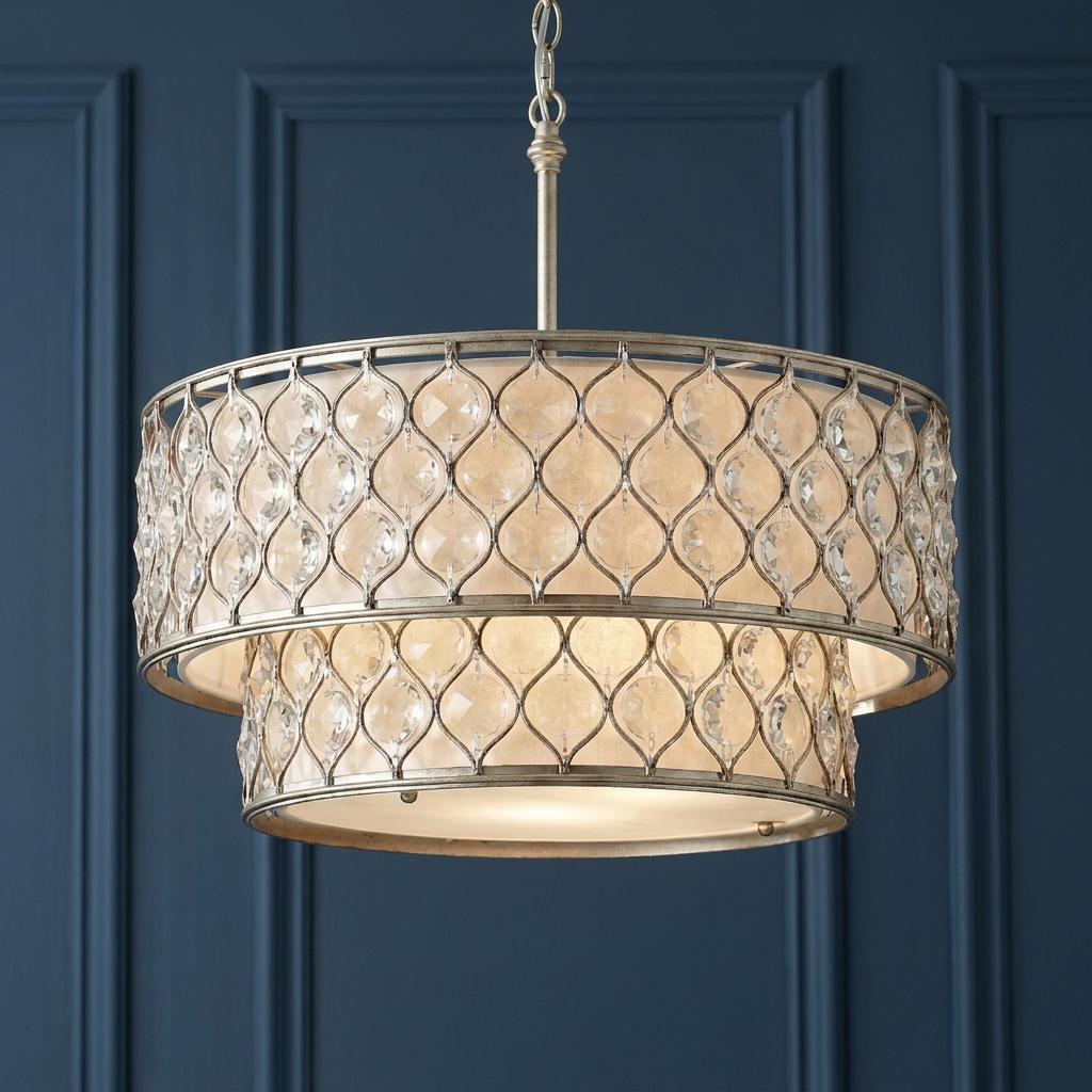 Feiss Lucia two-tier pendant chandelier with silver crystal lattice and cream shades against a dark blue wall.
