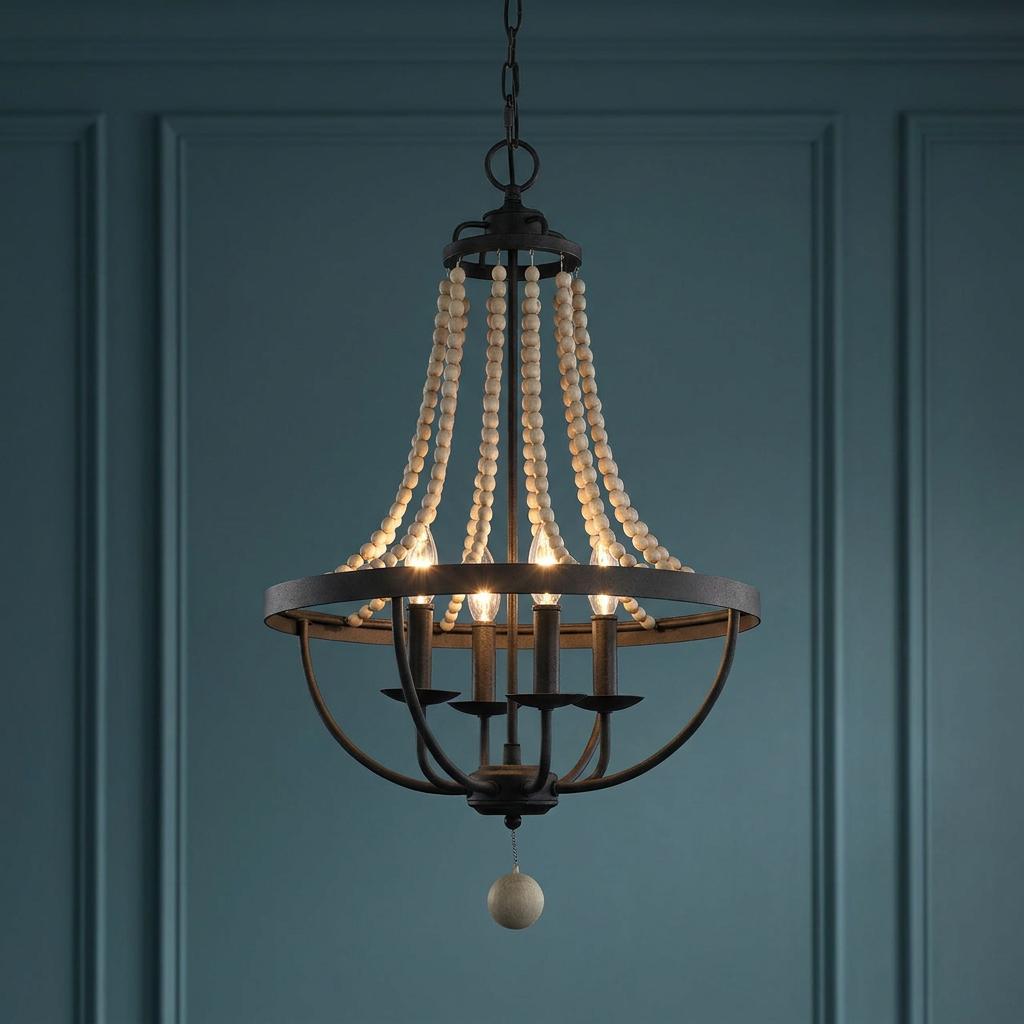 Feiss Nori four-light zinc and wood bead chandelier with lit bulbs against a dark blue paneled wall.
